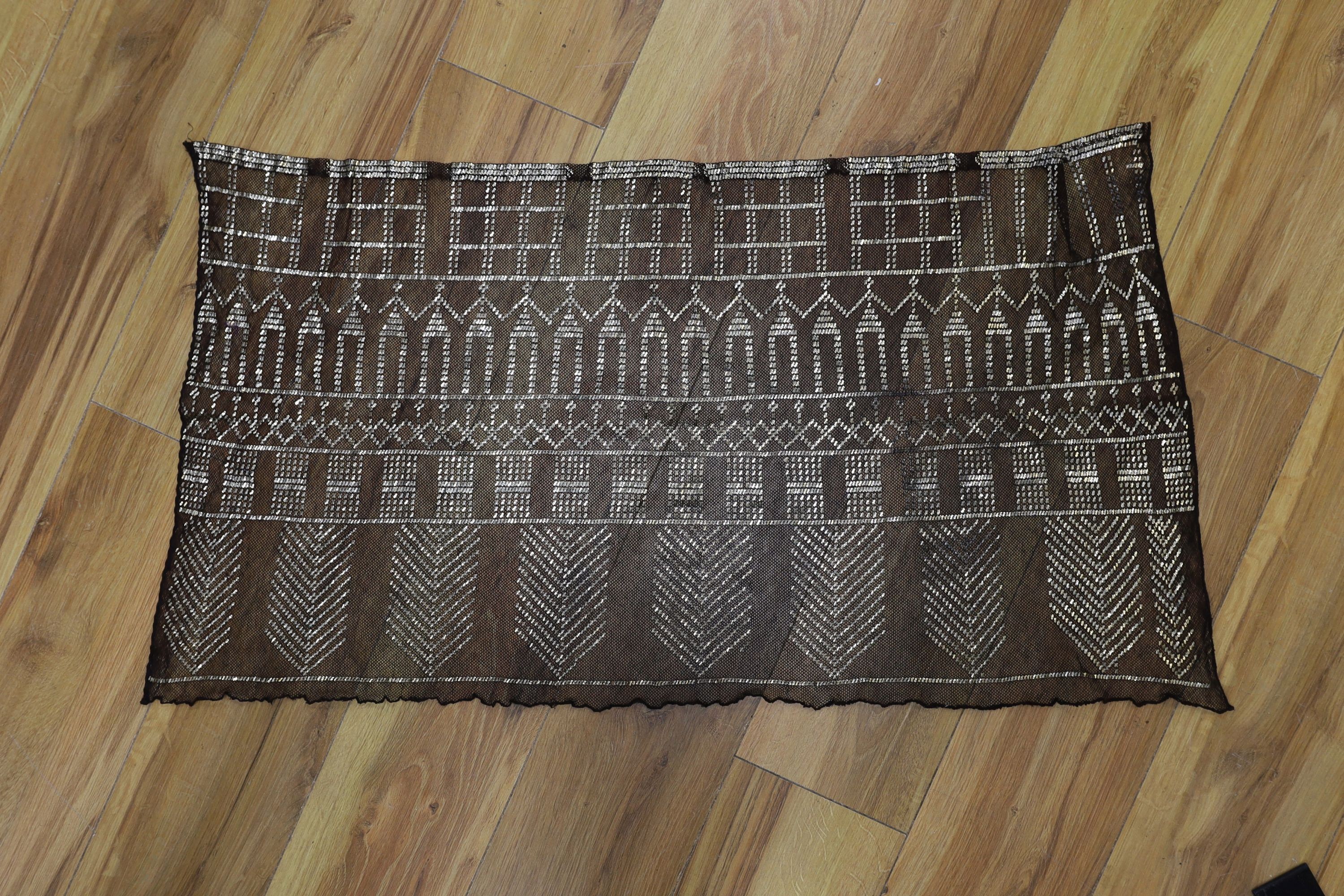 A dress made from a metal and black net Egyptian shawl; a similar shawl and a piece of shawl